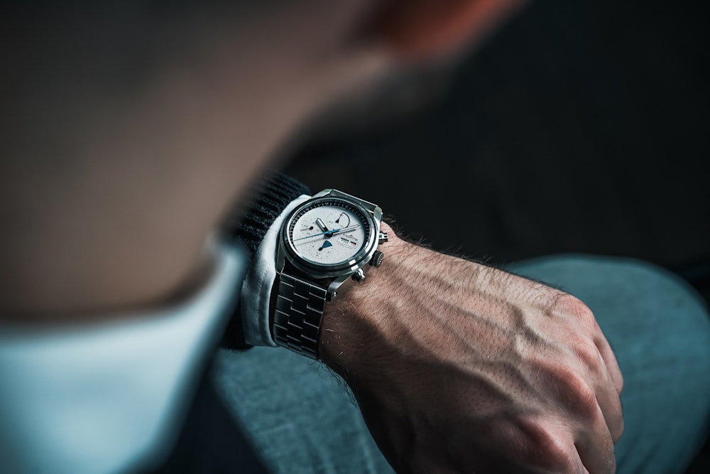 a close up of a person wearing a watch