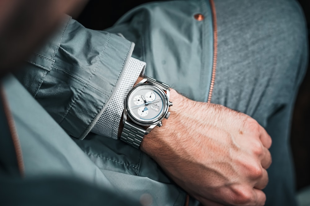 a close up of a person wearing a watch