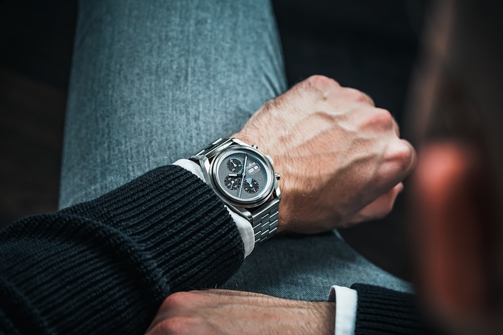 a close up of a person wearing a watch