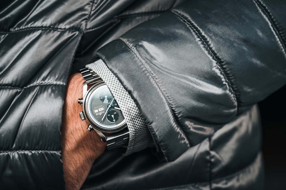 a close up of a person wearing a watch