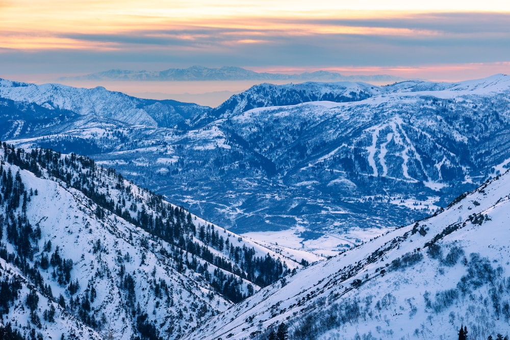 a view of a mountain range covered in snow