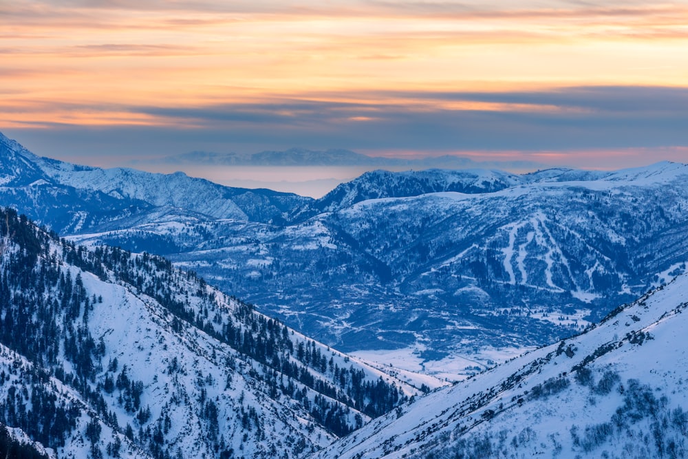 a view of a mountain range covered in snow