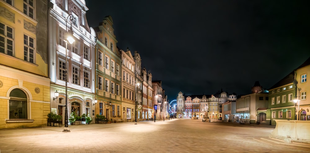 a city street is lit up at night