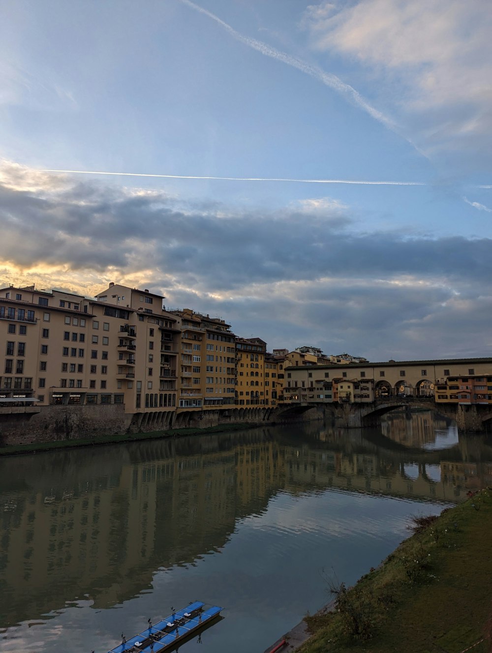 a river running through a city next to a bridge