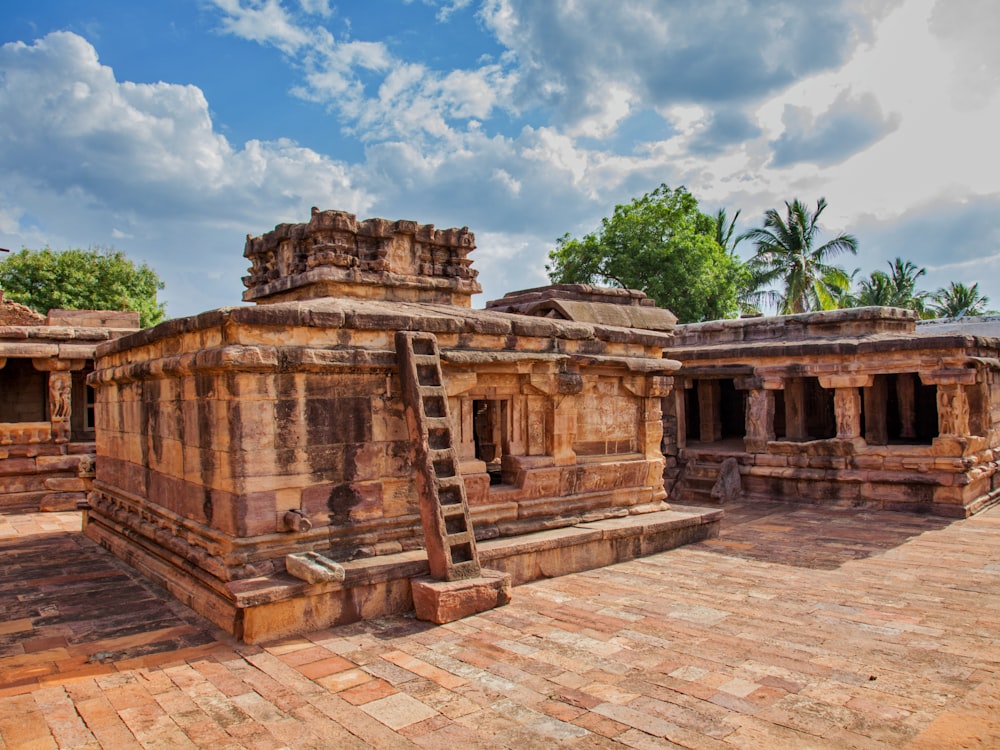 a stone structure with a ladder in the middle of it