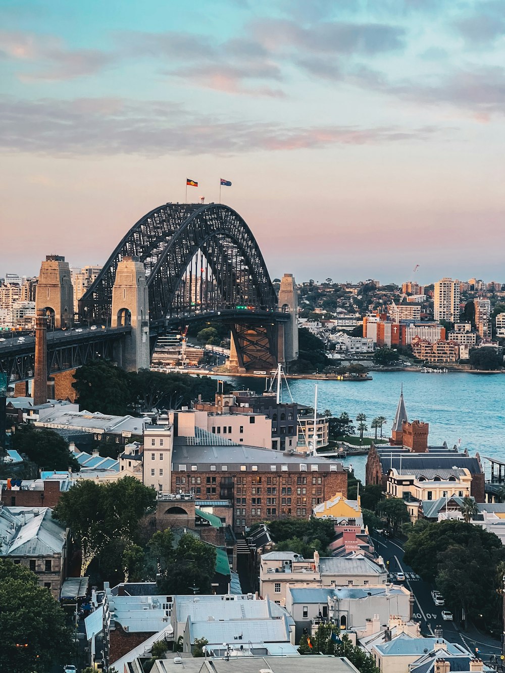 a view of a city with a bridge in the background