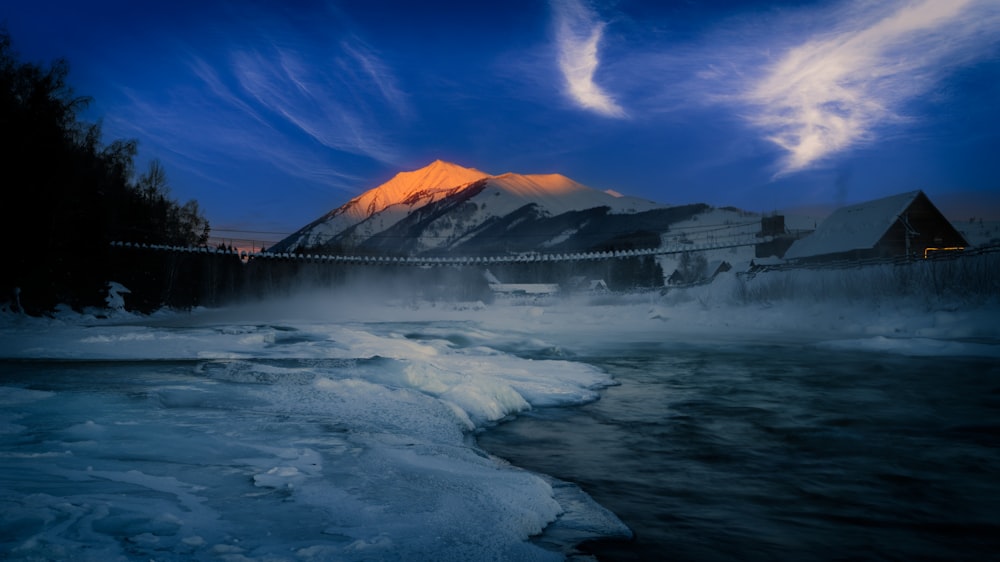 a river with a mountain in the background