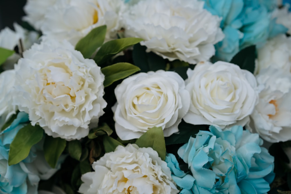 a bouquet of white and blue flowers