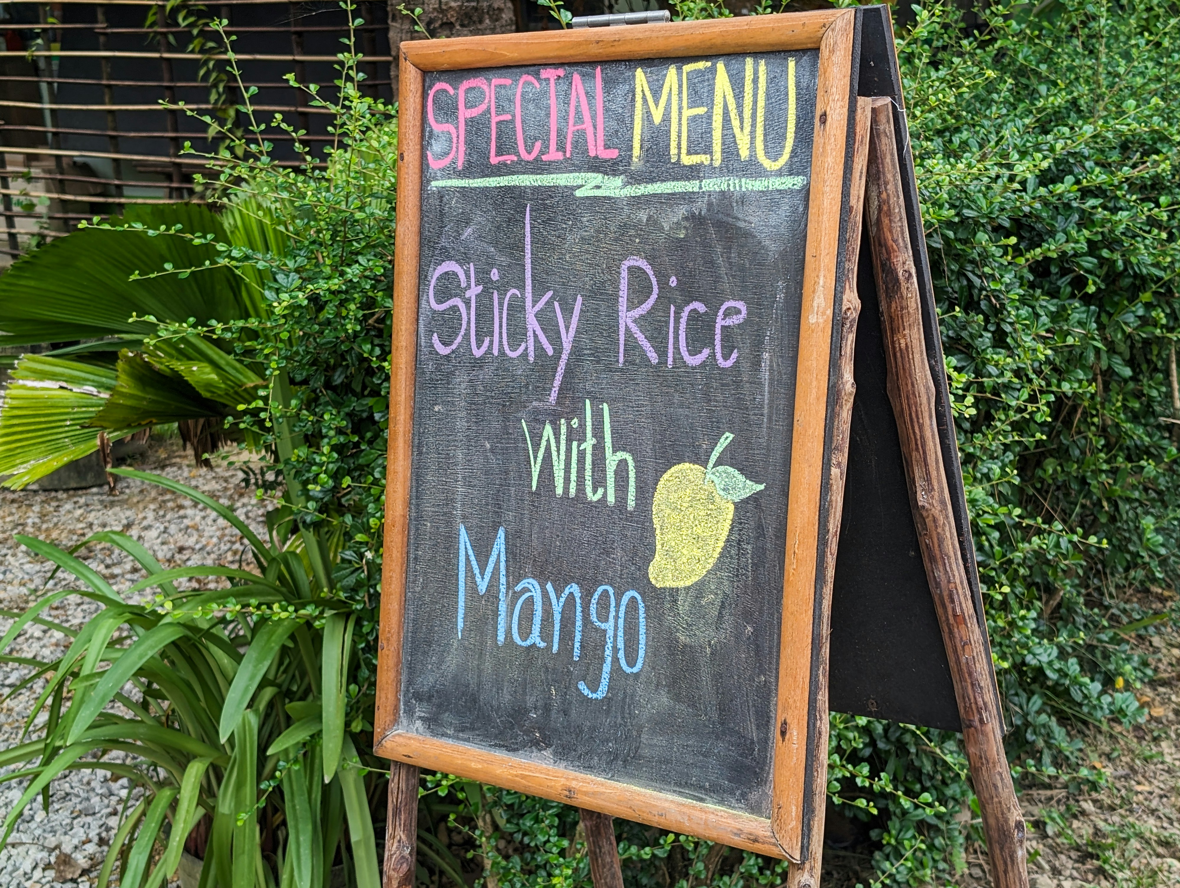Chalkboard sign for sticky rice with mango
