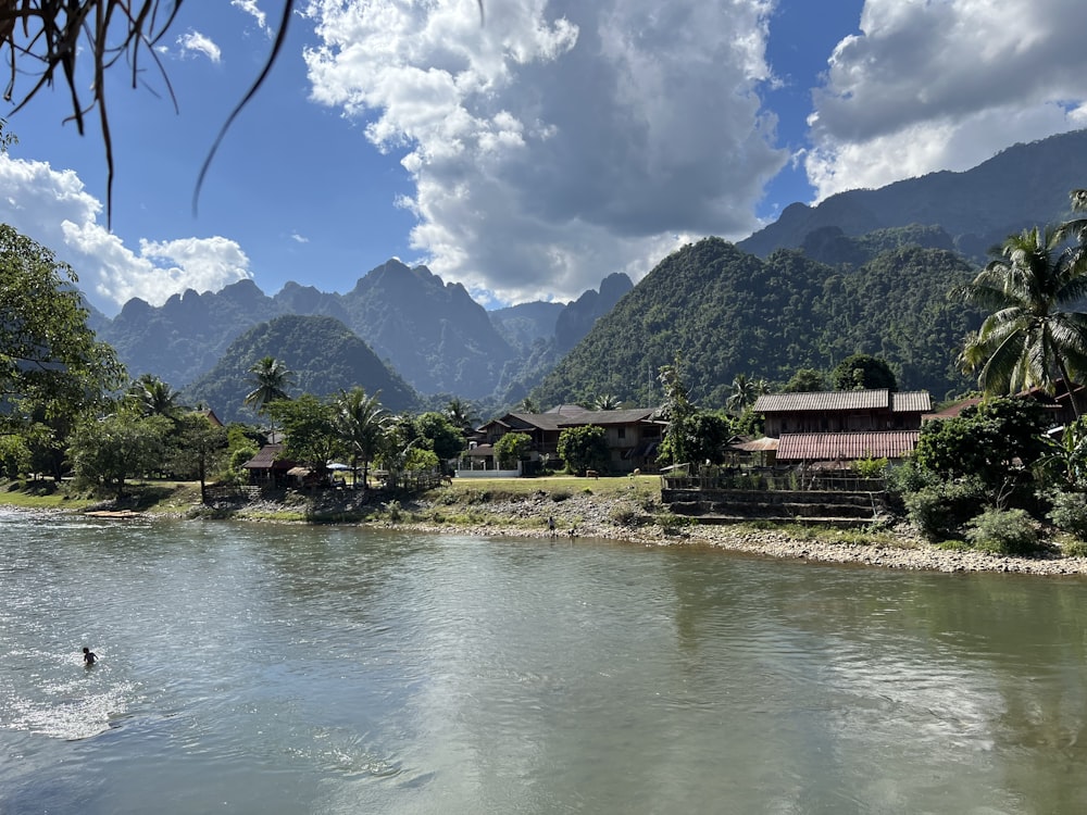 a body of water surrounded by mountains and trees