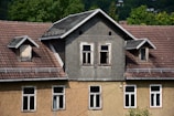 a house with a clock on the front of it