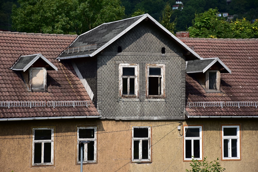 a house with a clock on the front of it