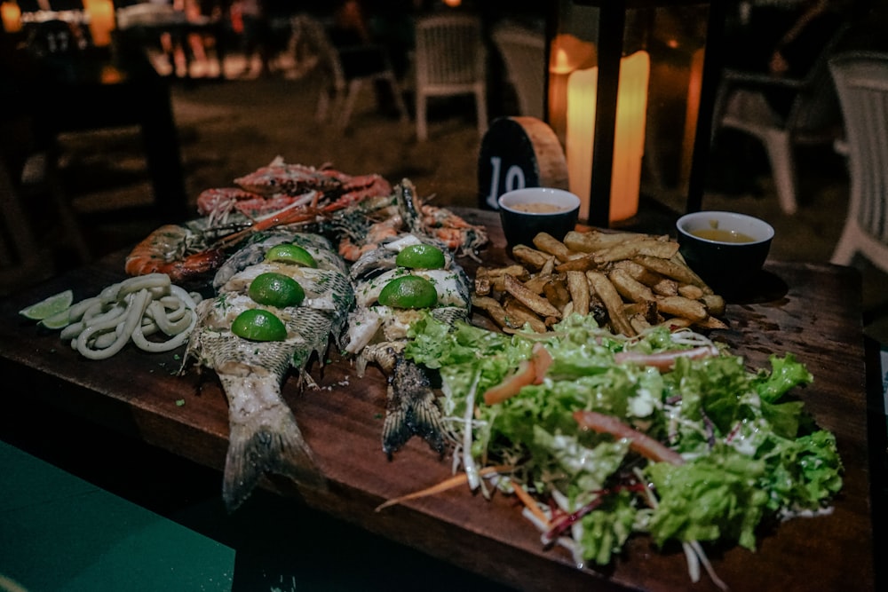 a wooden table topped with lots of food