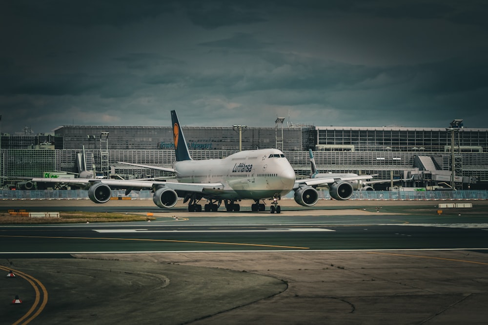 a large jetliner sitting on top of an airport tarmac