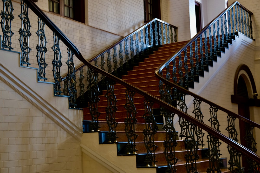 a set of stairs with wrought iron railings