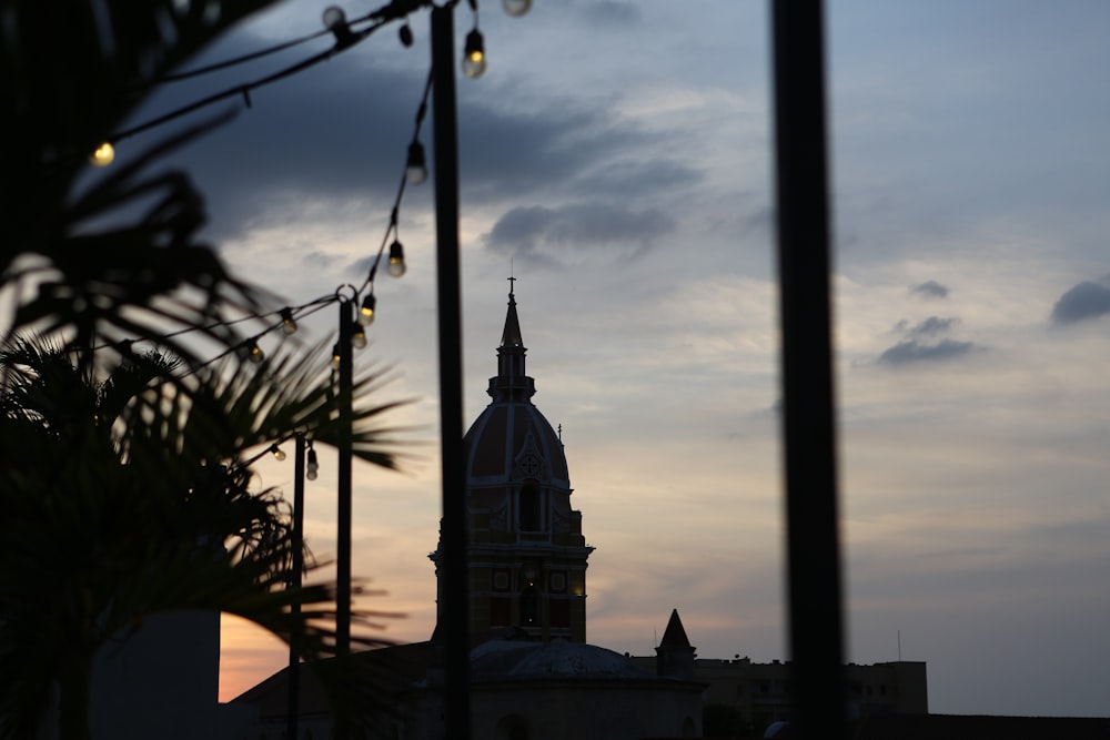 a view of a building with a clock tower in the background