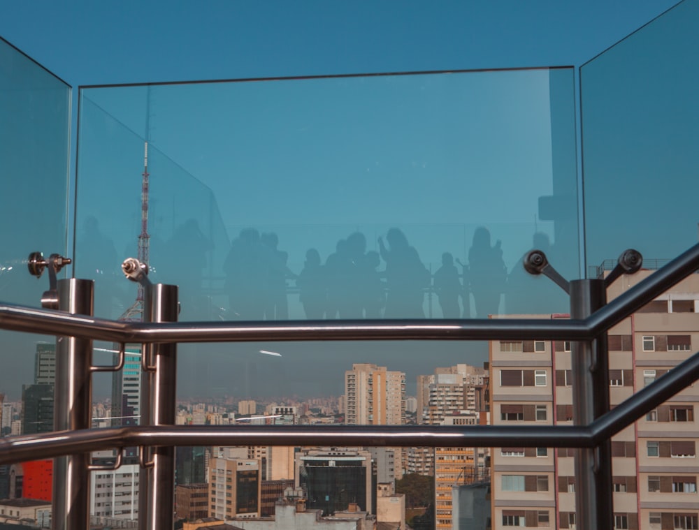 a group of people standing on top of a tall building