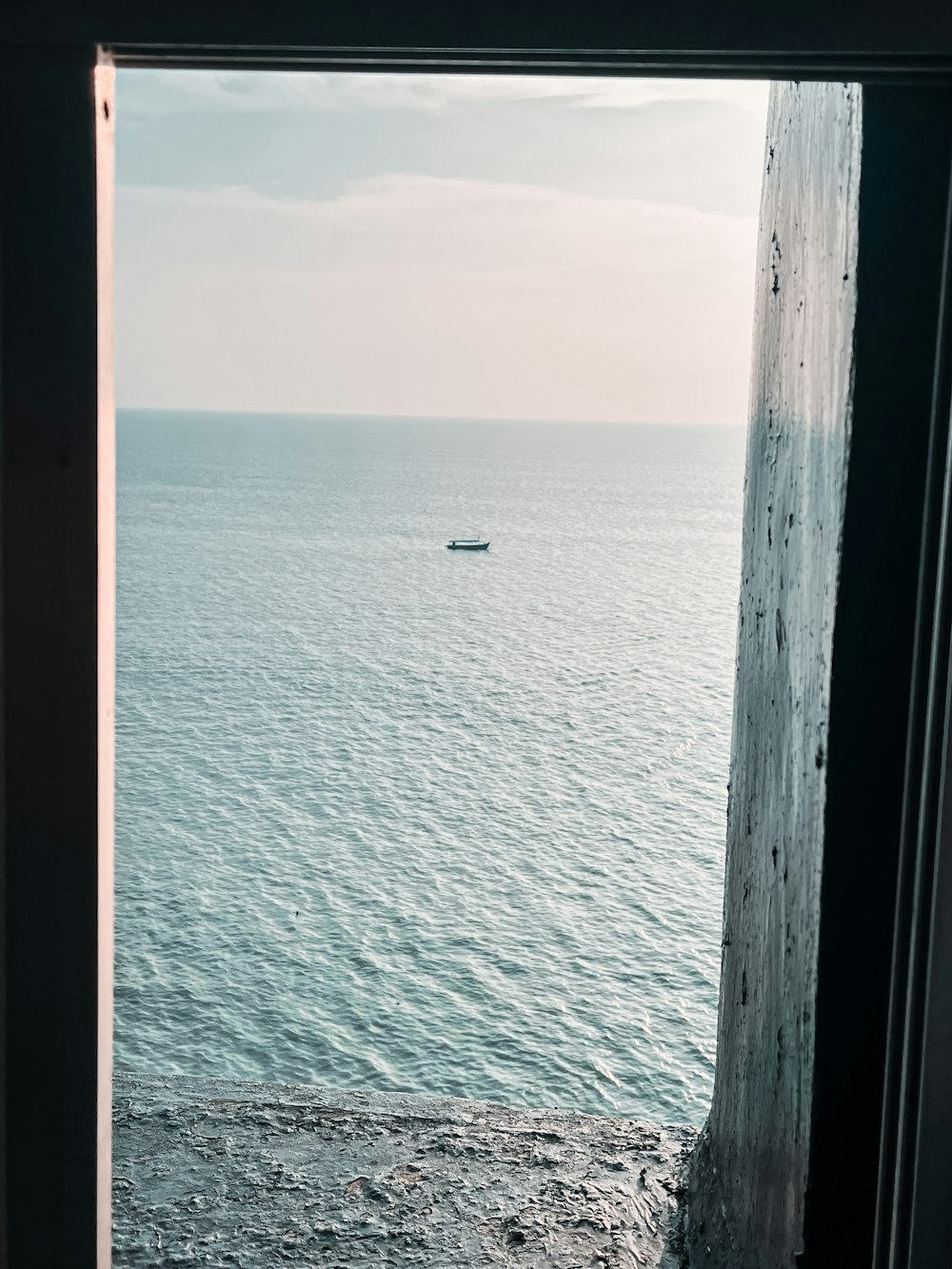 a view of the ocean from a window