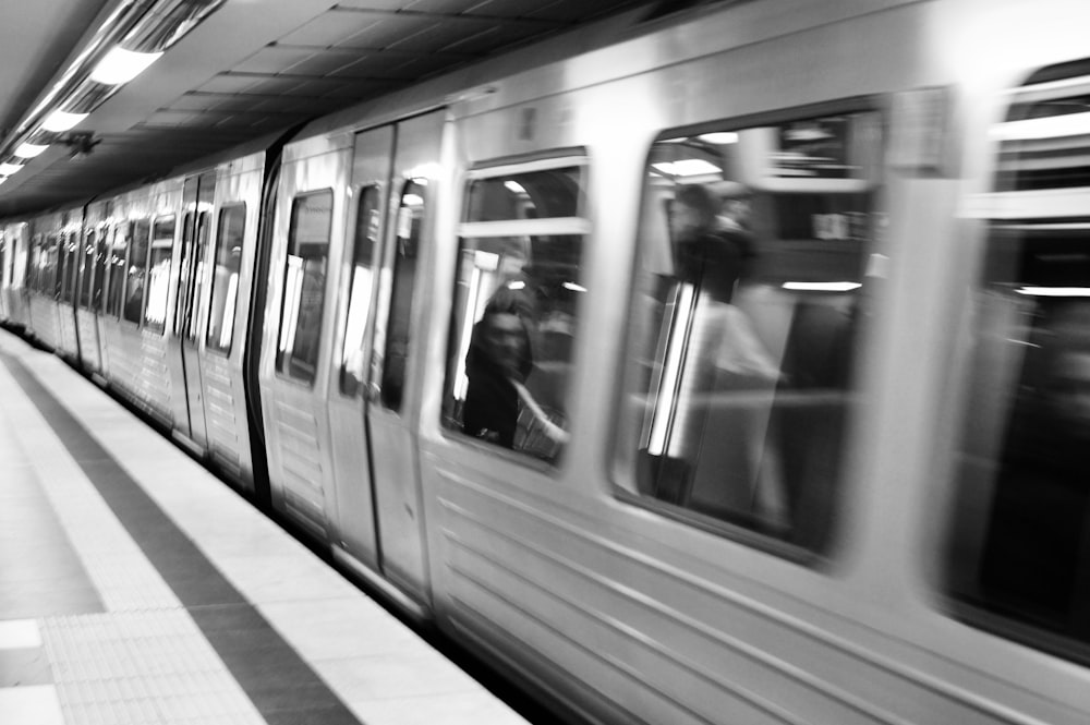 a black and white photo of a subway train