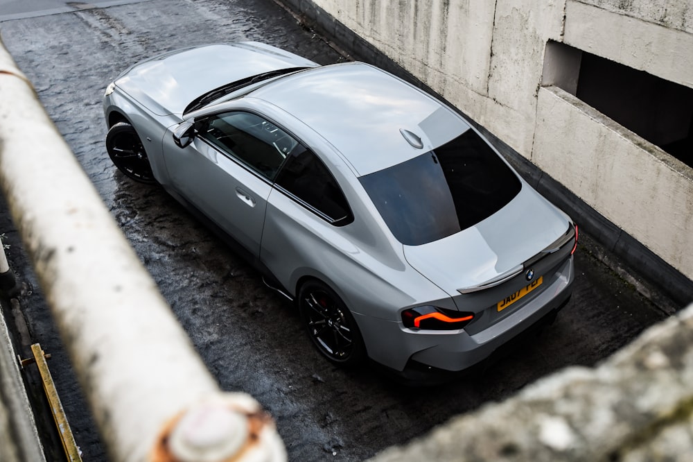 a silver sports car parked in a parking space