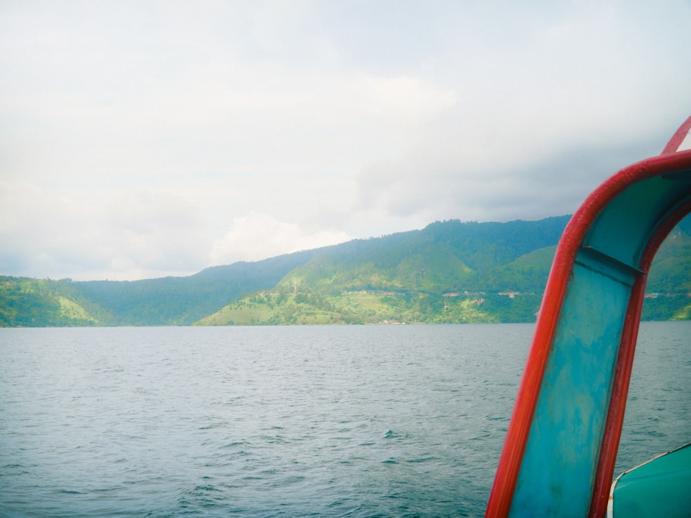 a view of a body of water with mountains in the background