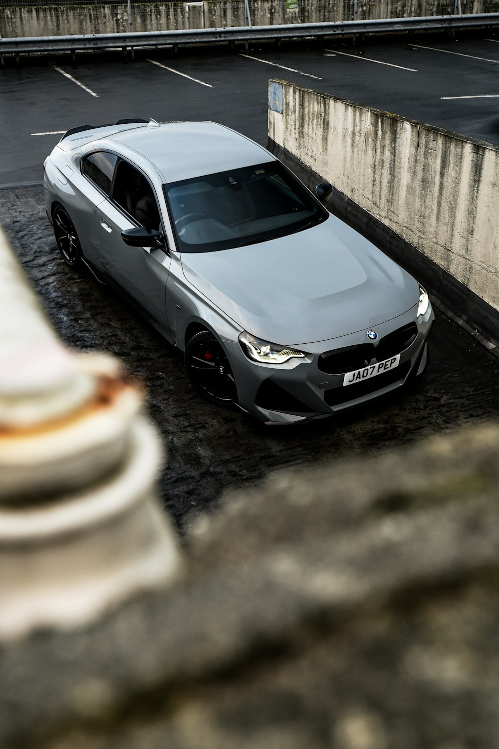 a silver car parked on the side of a road