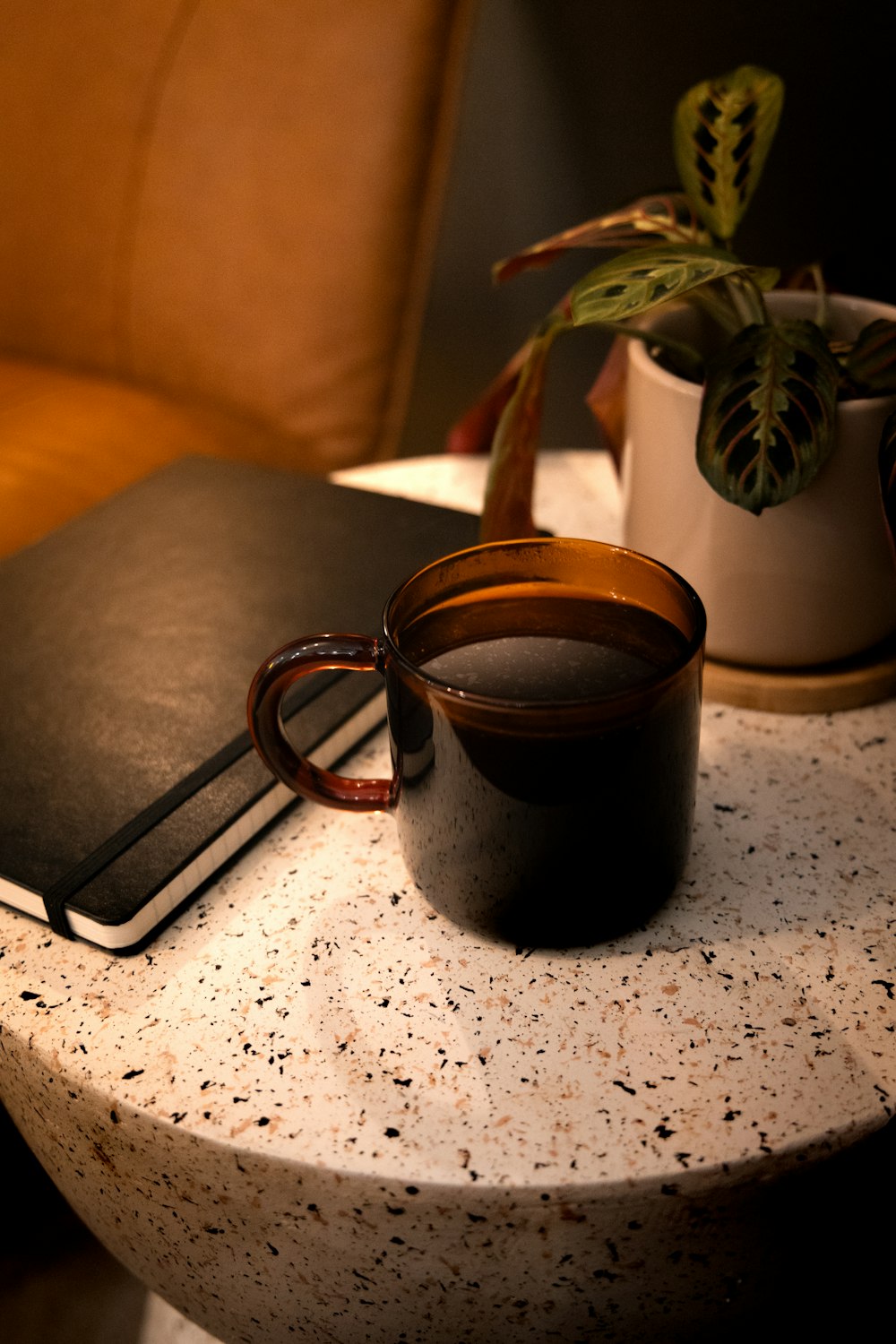 a book and a cup on a table