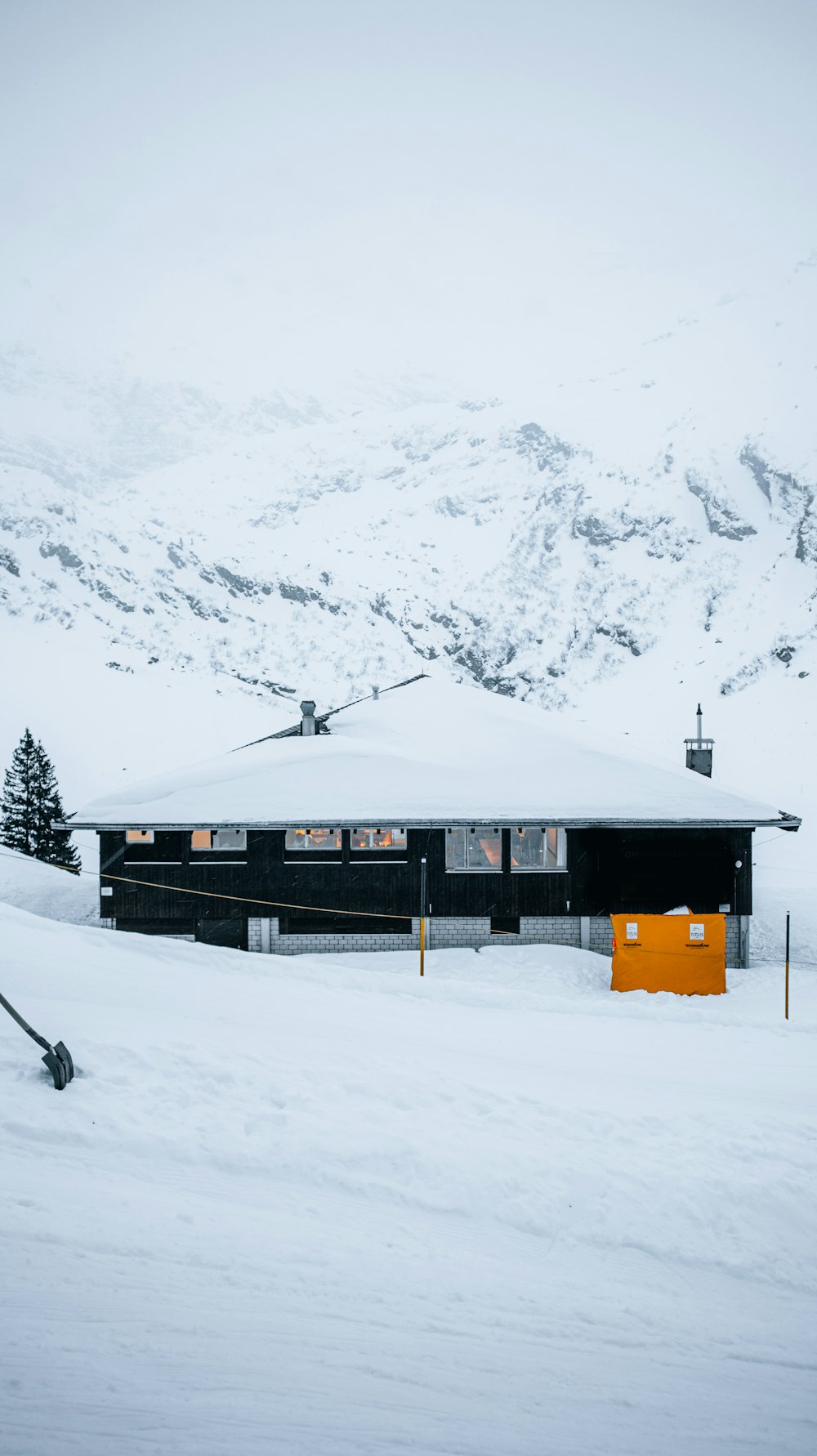 a ski lodge with a ski lift in the background