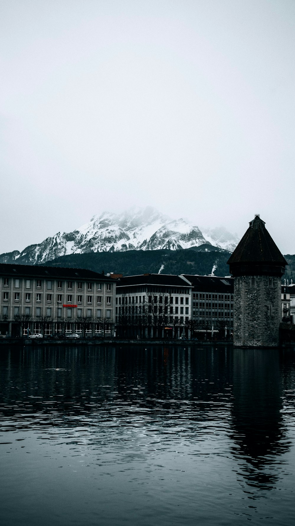 a large building sitting on top of a body of water