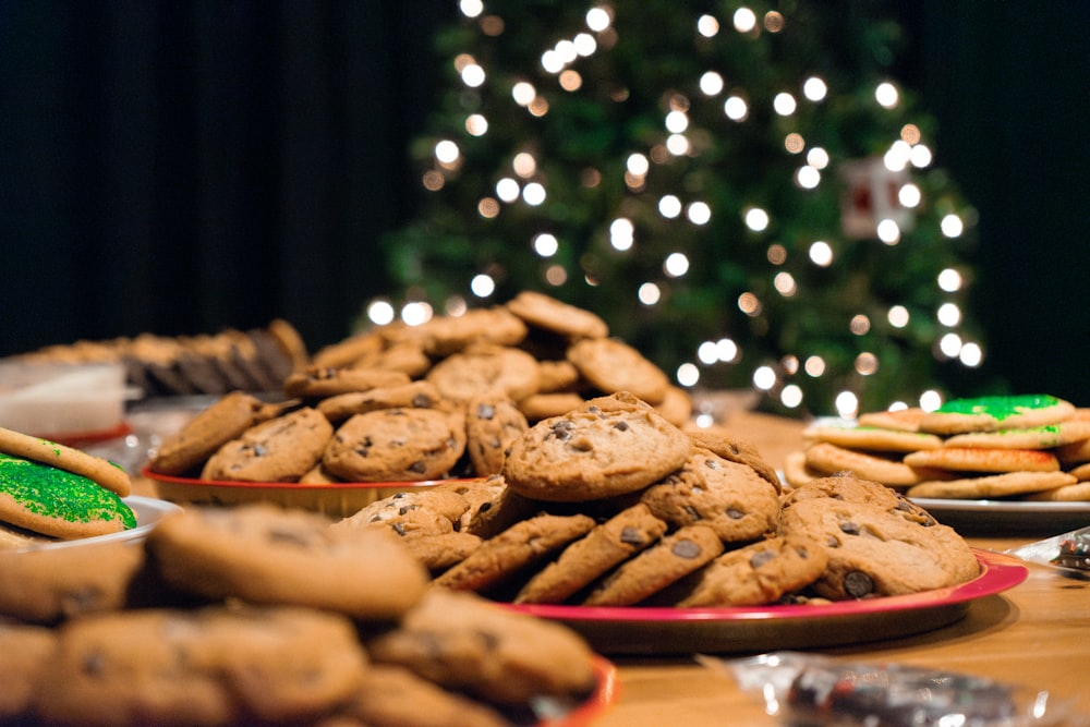 a table topped with plates of cookies and cookies