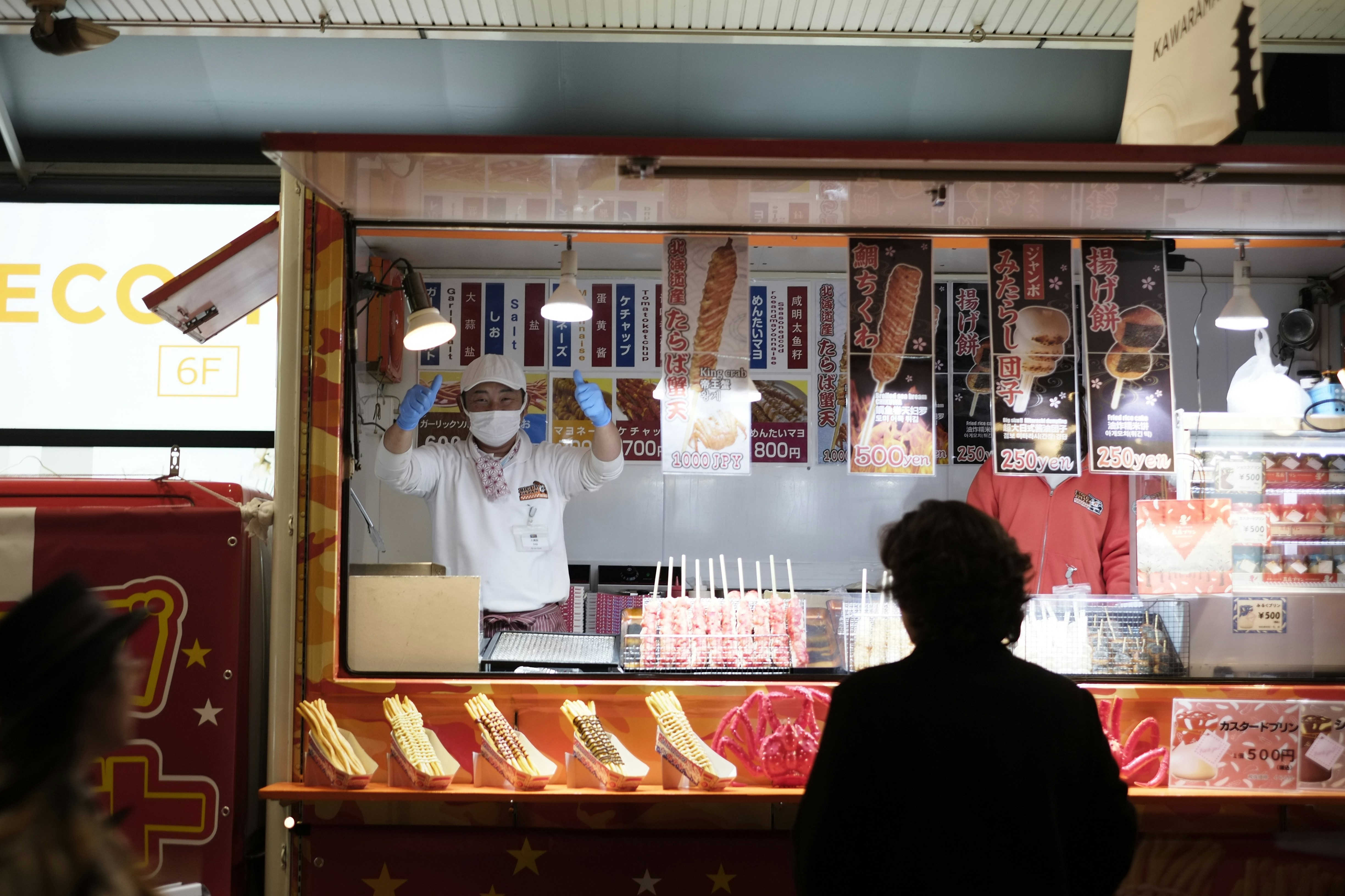 Customer at a food stall counter