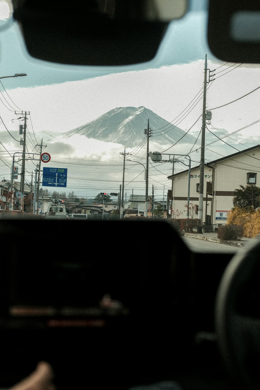 a view of a mountain from inside a car