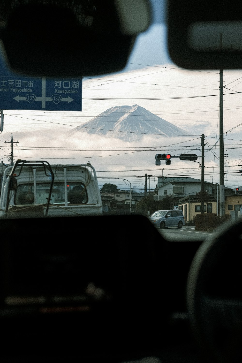 a view of a mountain from inside a vehicle