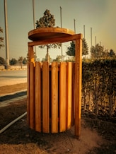 a wooden structure sitting in the middle of a field