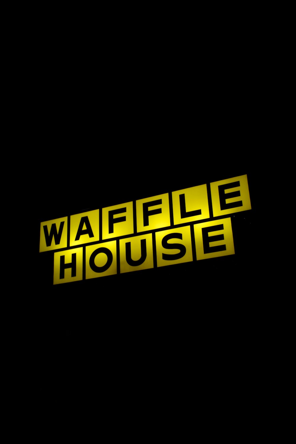 the waffle house logo on a black background