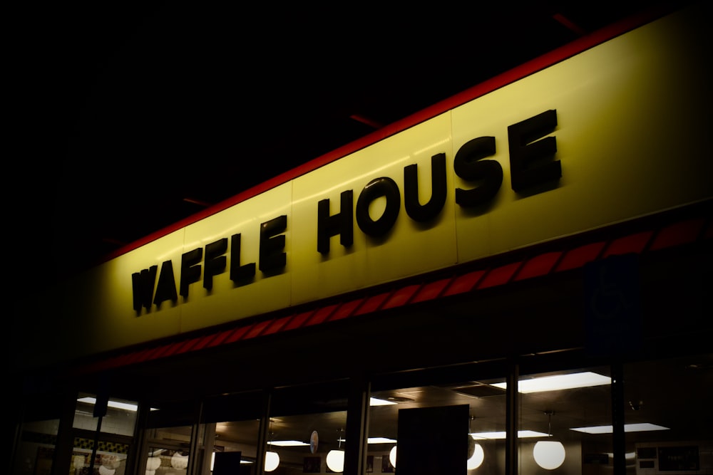 a store front at night with the lights on