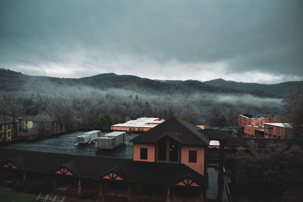 a view of a building with mountains in the background