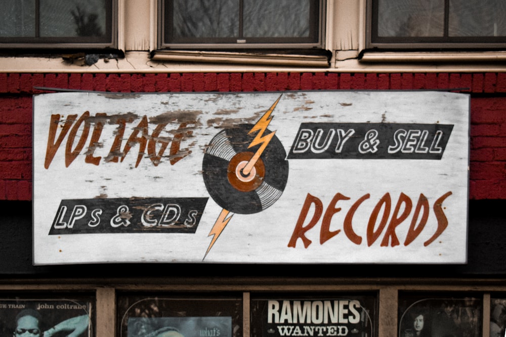 a sign on the side of a building advertising records