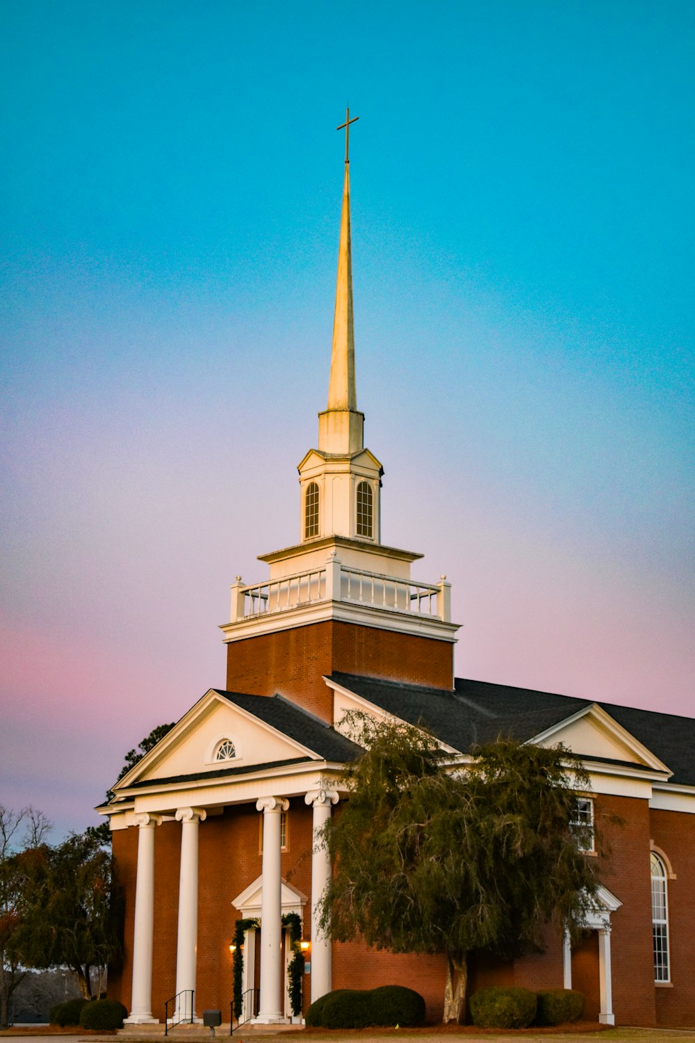 a church with a steeple and a clock tower