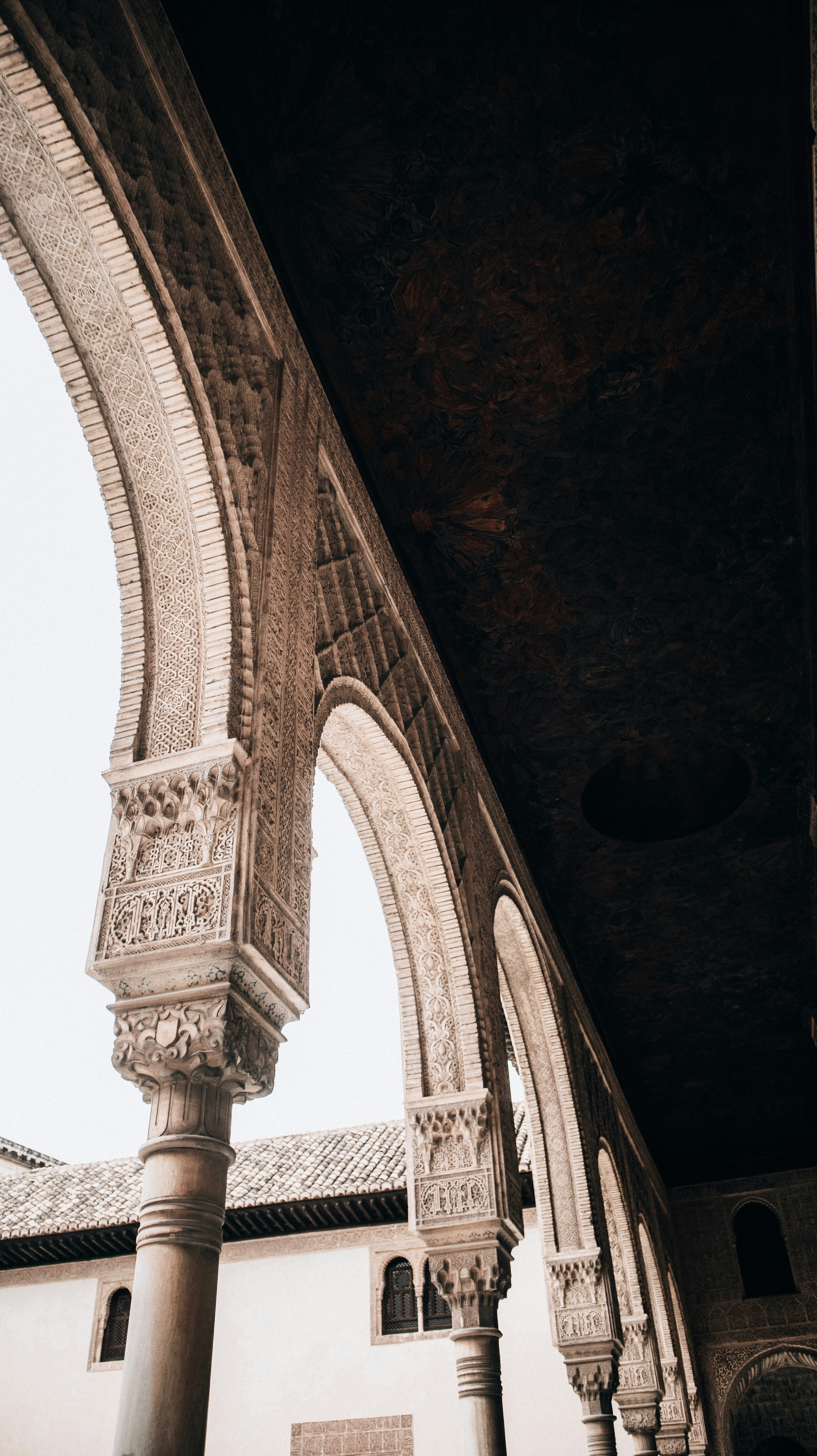 a black and white photo of an arch in a building