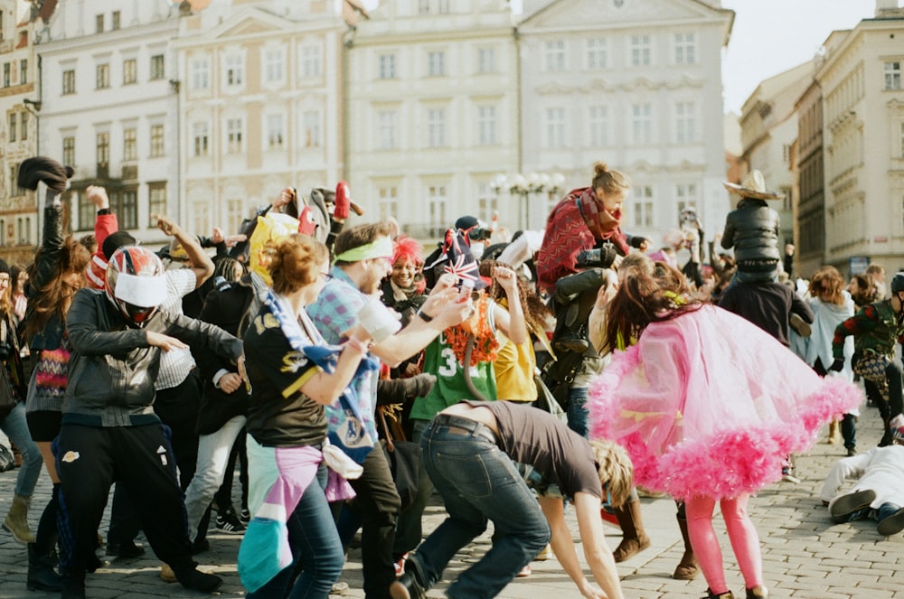 a group of people dancing in the street