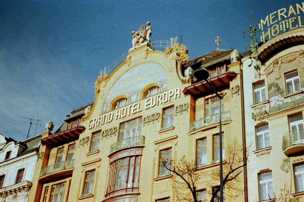 a tall building with a sign on top of it