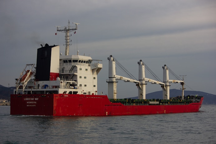 a large red and white boat in the water