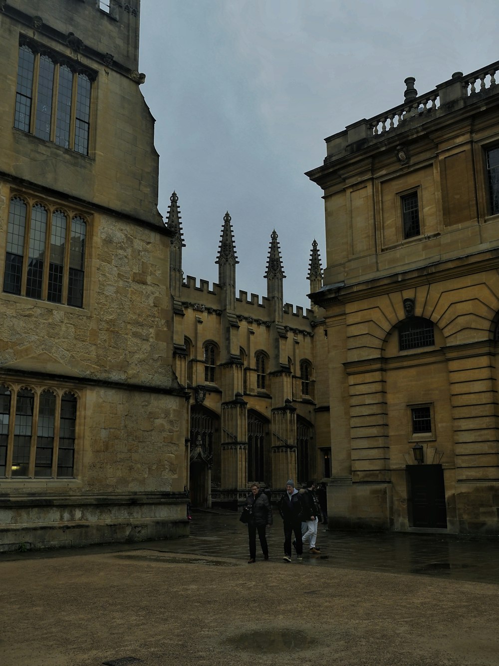 a group of people standing in front of a large building