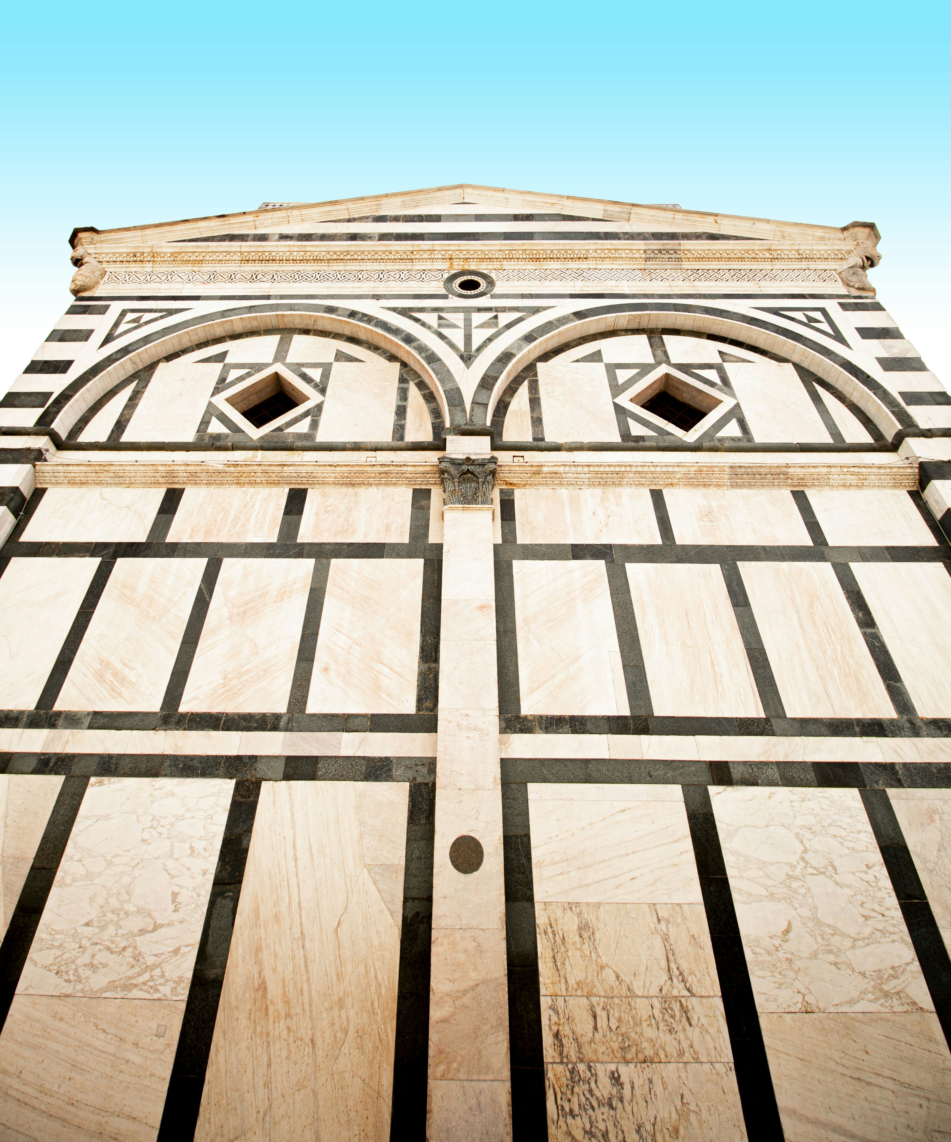 a tall tower with a clock on the top of it