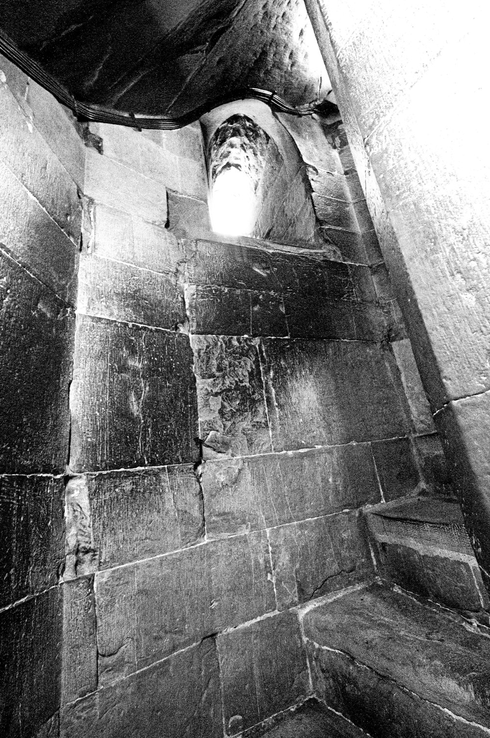 a black and white photo of a stairwell