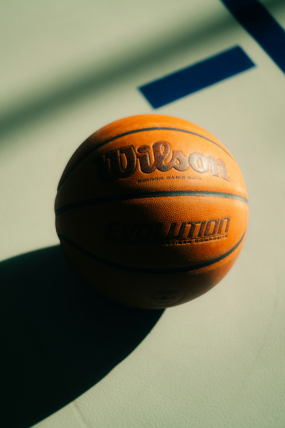 a close up of a basketball on a court