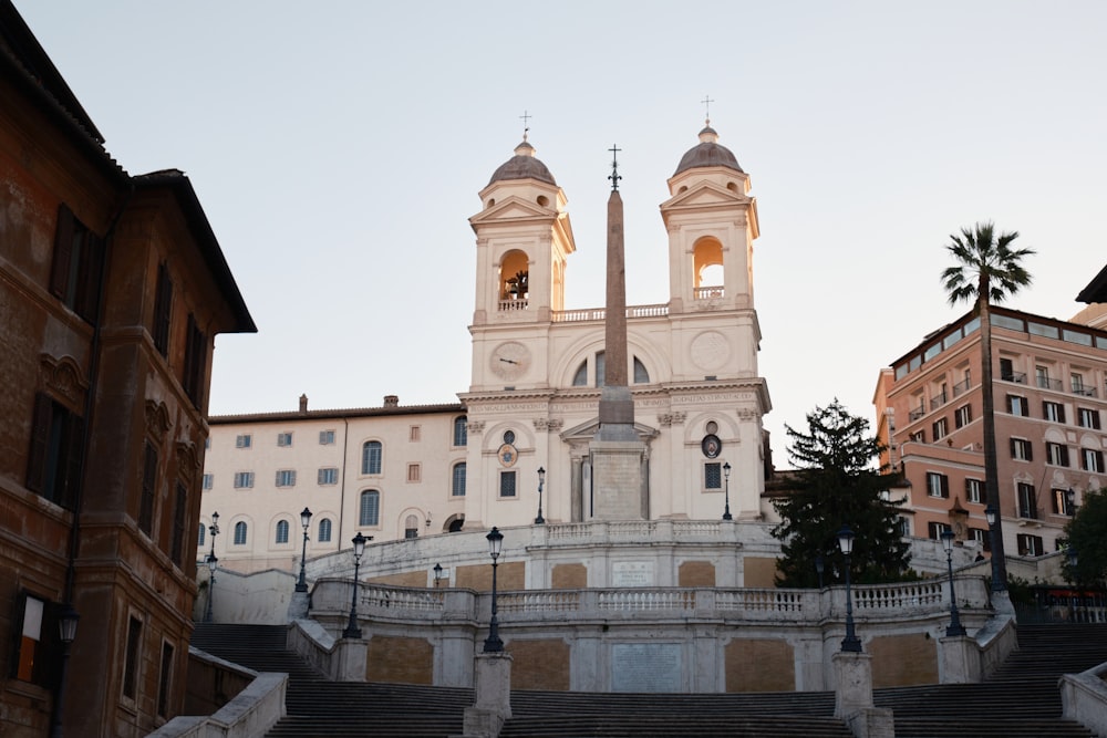 a church with a steeple and two bell towers