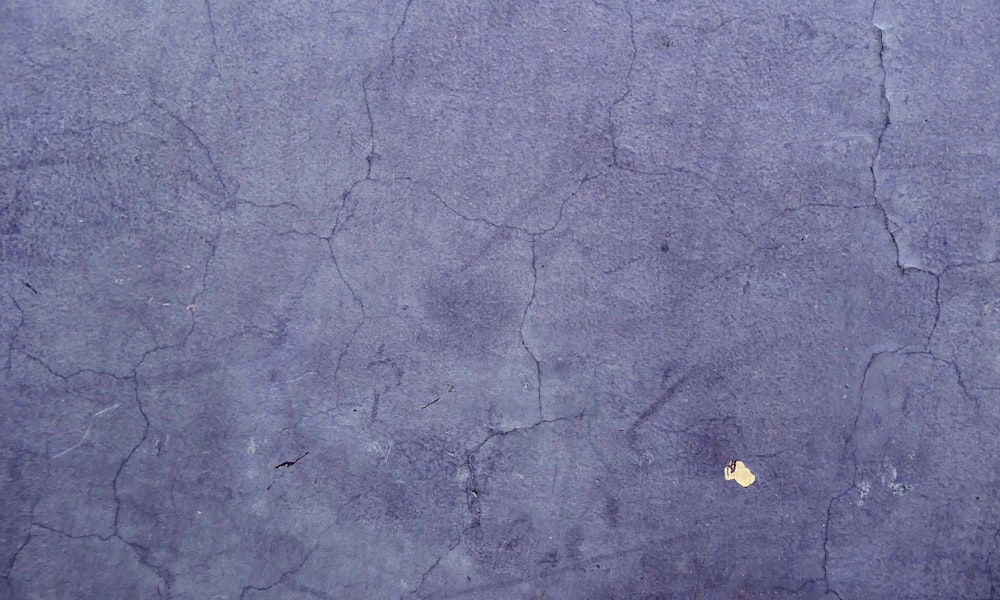 a yellow piece of paper sitting on top of a purple surface