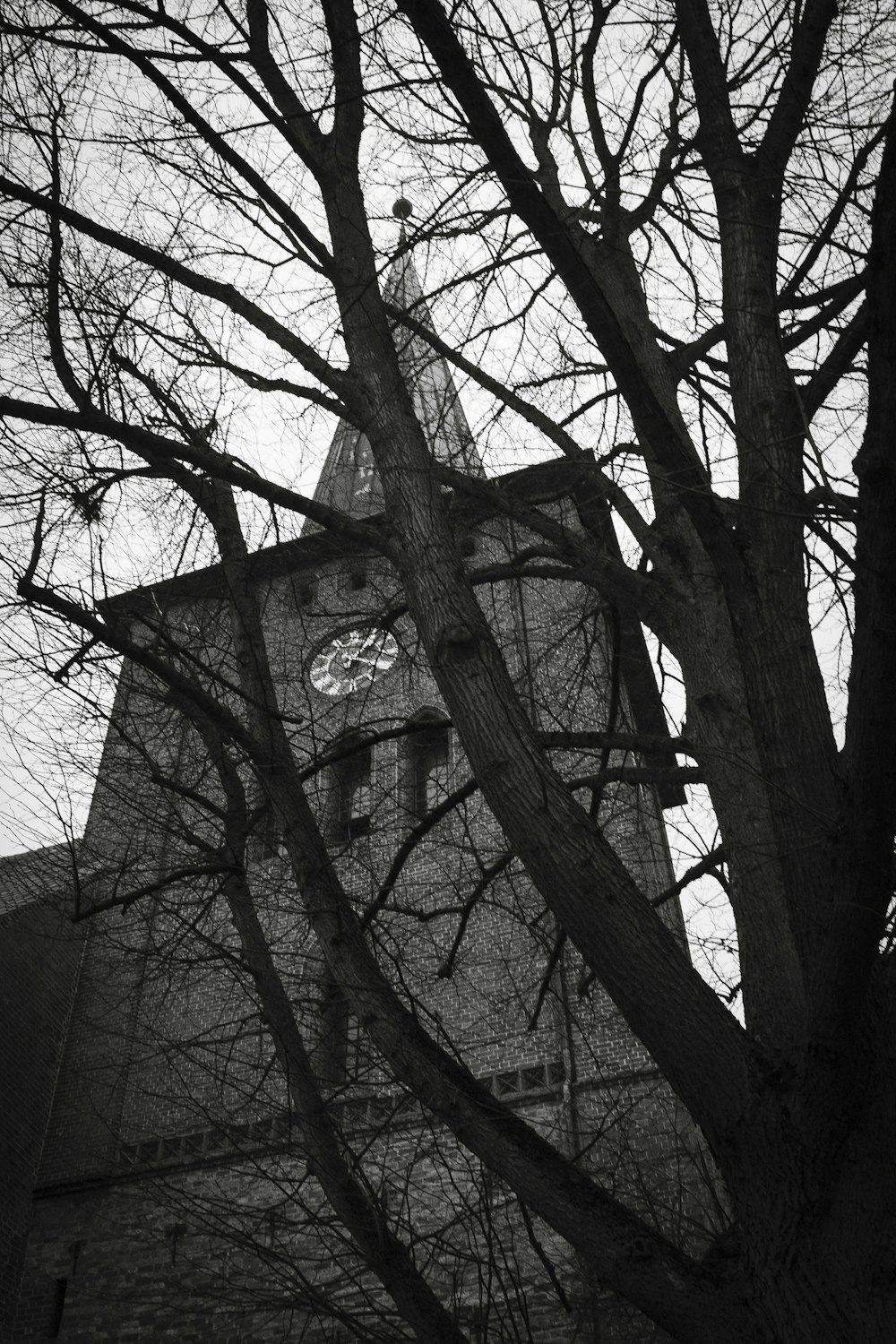 a tall tower with a clock on the side of it